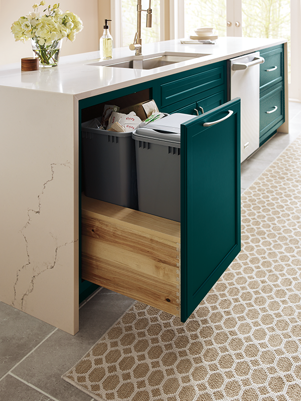 A base pullout kitchen cabinet with a drawer pull. 