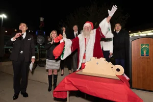 Supervisor Barger standing next to "Santa" waving at the "Arcadia Christmas Tree Lighting"
