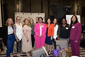 a group photo of people smiling.