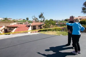 Supervisor Hahn speaking to a man outside a cautioned off area