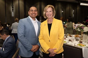Supervisor Hahn smiling for a photo with a man.