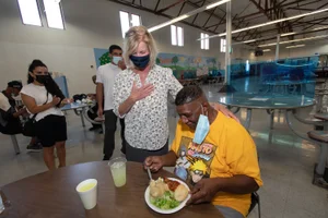 Supervisor Hahn speaking to young man at the Bell Shelter Tour