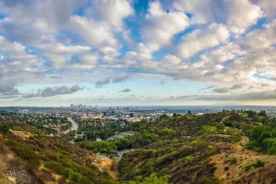 POV photo from the mountains with Downtown LA in the distance.