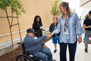 Supervisor Mitchell shaking hands in public