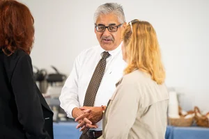 3 people speaking to each other at event