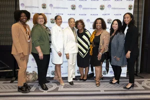 a group of women smiling.