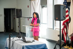a woman speaking at a podium
