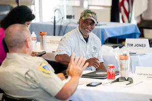 2 people speaking to each other at event