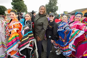 Supervisor Mitchell in a group picture at a parade