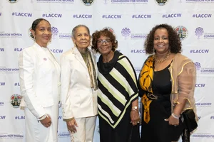 a group of women smiling.
