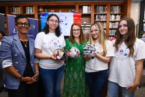 Supervisor Horvath group photo holding up sports balls