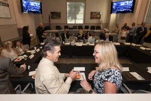 Supervisor Barger speaking to a man at the South Pasadena City Breakfast