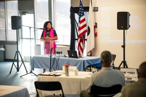 a woman speaking at a podium