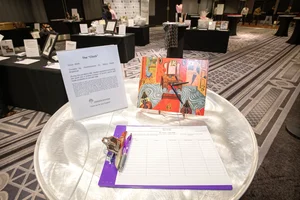 Clipboard with a paper to be filled out on a round table.