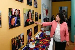 Supervisor Solis looking at pictures on a wall