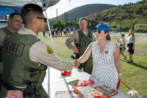 Supervisor Horvath shaking hands with a sheriff in Westlake