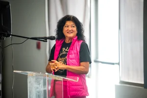 a woman speaking at a podium