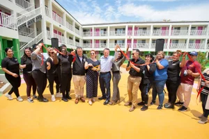Supervisor Horvath at a ribbon cutting in front of a building