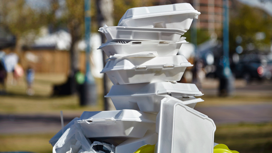 A stack of styrofoam to-go food boxes.