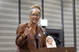 Supervisor Mitchell speaking at a podium.