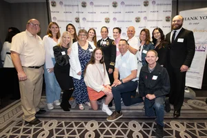 group photo of people smiling.