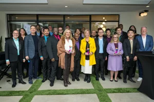 Supervisor Barger group photo in front of an office building