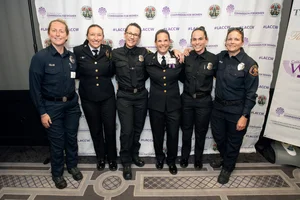 6 women posing for a photo.