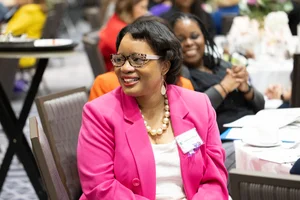 a women sitting at a table.
