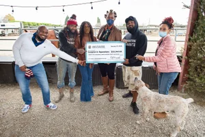 Supervisor Mitchell presenting a 25 thousand dollar check