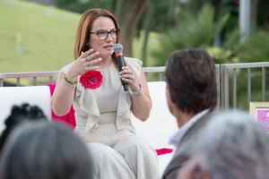 Supervisor Horvath speaking into a microphone at an event