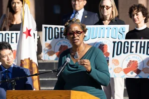 Supervisor Mitchell speaking at a United Against Hate Week rally