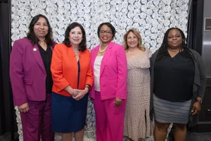 Supervisor Holis smiling for a photo with 4 other women.