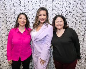 3 women posing for a photo.