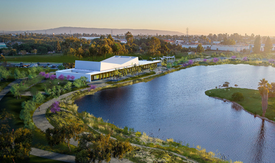 Aerial view of a building on a lake.