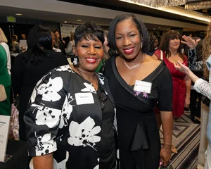 2 women posing for a photo together.