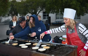 Supervisor Barger cooking pancakes in public