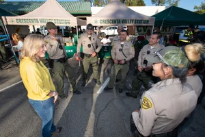 Supervisor Barger speaking to a group of officers in a circle