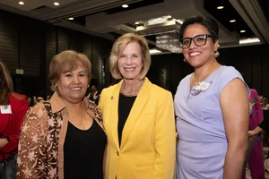 Supervisor Hahn smiling for a group photo with 2 other women.