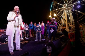 Supervisor Mitchell speaking at a carnival/fair