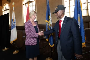 Supervisor Hahn shaking hand at the 8th Annual Metro Veterans Luncheon