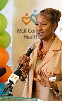 Background photo of Holly J. Mitchell