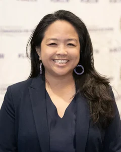 Woman smiling for a photo.