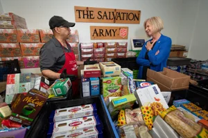 Supervisor Hahn speaking to worker at the Torrance Salvation Army Check Presentation