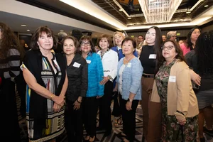 group of women posing for a photo.