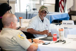 2 people speaking to each other at event