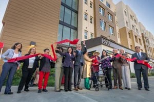 Supervisor Solis cutting a ribbon at the HiFi Collective Permanent Supportive Housing Grand Opening
