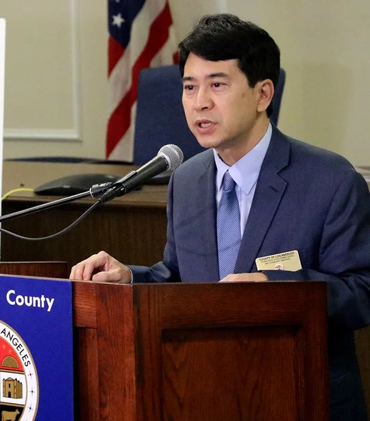 Photo of Robin Toma speaking at a podium