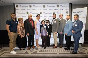 a group of people smiling.