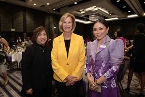 Supervisor Hahn smiling for a photo with two other women.