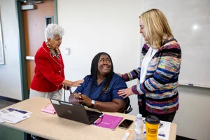 Supervisor Barger speaking with a woman at the "Veterans Forum with Congresswoman Napolitano"